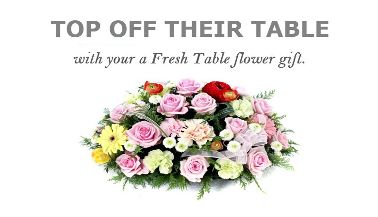 TOP OFF THEIR TABLE with your a fresh flower gift.